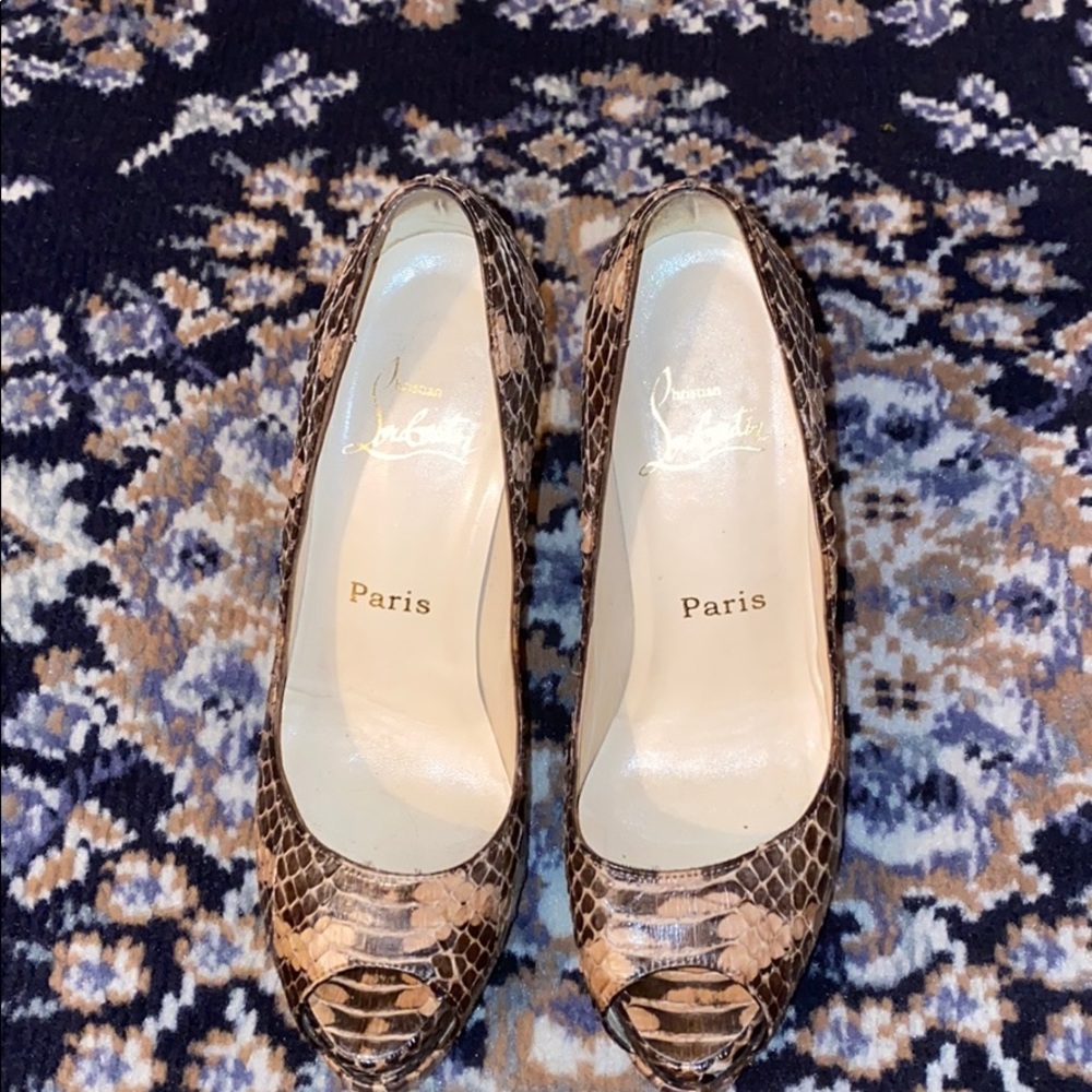 Christain Louboutin snake skin pumps